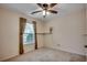 Bedroom features neutral walls, carpeted floor, natural light, and ceiling fan at 645 Twinflower St., Little River, SC 29566