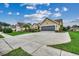 Charming home with a gray two-car garage, manicured lawn, and a welcoming driveway at 645 Twinflower St., Little River, SC 29566