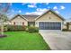 Inviting home with a well-maintained lawn, charming landscaping, and a spacious two-car garage at 645 Twinflower St., Little River, SC 29566
