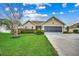 Charming single-story home with well-manicured lawn and mature landscaping at 645 Twinflower St., Little River, SC 29566