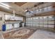 Functional garage with ample storage solutions including cabinets and overhead racks, along with plenty of space at 645 Twinflower St., Little River, SC 29566