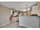 Well-lit kitchen with granite countertops and white cabinetry with ample storage space at 645 Twinflower St., Little River, SC 29566