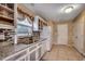 Spacious kitchen featuring granite countertops, stainless steel appliances, and white cabinetry at 645 Twinflower St., Little River, SC 29566