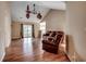 Open living room features vaulted ceiling, wood floors, and sliding glass doors at 645 Twinflower St., Little River, SC 29566