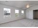 Bright bedroom with three large windows offering views of the surrounding community and natural light at 667 Mccorkle Place, Conway, SC 29526