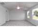 Bright bedroom featuring carpet floors, a ceiling fan, and ample light from windows at 667 Mccorkle Place, Conway, SC 29526