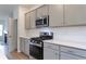 Open concept kitchen with large island and view into the living room at 667 Mccorkle Place, Conway, SC 29526