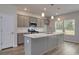 Modern kitchen featuring gray cabinets, stainless steel appliances, and a kitchen island at 667 Mccorkle Place, Conway, SC 29526