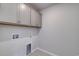 Well-lit laundry room with overhead cabinets and utility connections at 667 Mccorkle Place, Conway, SC 29526
