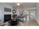 Elegant living room with a fireplace, modern decor, and an open floor plan at 667 Mccorkle Place, Conway, SC 29526