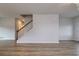 Large open concept living room with hardwood floors and stairway leading to the second floor at 667 Mccorkle Place, Conway, SC 29526