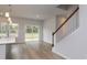 Bright open living space with stairs, sliding glass doors, and hardwood floors at 667 Mccorkle Place, Conway, SC 29526