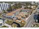 Aerial view of St. John's Inn, showcasing the pool, landscaping, and proximity to the road at 6803 Ocean Blvd. N # 109, Myrtle Beach, SC 29572