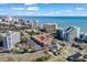 Coastal complex aerial view featuring rooftop units, parking, and nearby ocean; highlighted with map marker at 6803 Ocean Blvd. N # 109, Myrtle Beach, SC 29572