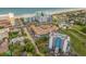 Aerial view of St. John's Inn with pool, parking, and nearby lodging buildings near beach and coastline at 6803 Ocean Blvd. N # 109, Myrtle Beach, SC 29572