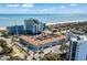 Coastal complex aerial view showcases oceanfront location with pool, manicured landscaping and spacious parking at 6803 Ocean Blvd. N # 109, Myrtle Beach, SC 29572