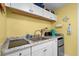 Close-up of kitchenette with granite counters, white cabinets, and stainless steel appliances at 6803 Ocean Blvd. N # 109, Myrtle Beach, SC 29572