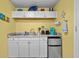 Efficient kitchenette with white cabinetry, a mini-fridge, and essential appliances at 6803 Ocean Blvd. N # 109, Myrtle Beach, SC 29572