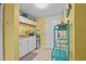 Cozy kitchenette with white cabinets, granite counters, and a mini fridge at 6803 Ocean Blvd. N # 109, Myrtle Beach, SC 29572
