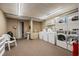 Bright laundry room with multiple machines and a utility sink for added convenience in a shared space at 6803 Ocean Blvd. N # 109, Myrtle Beach, SC 29572