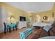Well-decorated open living space with blue accents, a kitchenette, and a queen bed at 6803 Ocean Blvd. N # 109, Myrtle Beach, SC 29572