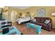 Open living space featuring a queen bed, a comfortable sofa, and coordinated decor at 6803 Ocean Blvd. N # 109, Myrtle Beach, SC 29572