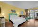 Charming living space with a bed, a sofa, patio access, and beach-themed decor at 6803 Ocean Blvd. N # 109, Myrtle Beach, SC 29572