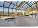 Indoor pool with a hot tub and many tables and chairs at 6900 N Ocean Blvd. # 1235, Myrtle Beach, SC 29572