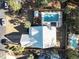 An aerial view showcases the home with a private pool and a well maintained yard surrounded by mature trees at 799 Mount Gilead Place Dr., Murrells Inlet, SC 29576