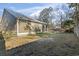Large backyard with a screened porch, swimming pool, privacy fence, and grass at 799 Mount Gilead Place Dr., Murrells Inlet, SC 29576