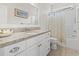 Bright bathroom featuring a granite countertop vanity, a large mirror, and a shower with floral curtain at 799 Mount Gilead Place Dr., Murrells Inlet, SC 29576