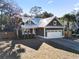 Charming single-Gathering home showcasing a metal roof, 2-car garage and well-maintained landscaping at 799 Mount Gilead Place Dr., Murrells Inlet, SC 29576