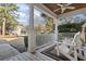 Inviting front porch featuring comfortable seating, offering a relaxing outdoor space to enjoy the neighborhood views at 799 Mount Gilead Place Dr., Murrells Inlet, SC 29576