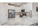 Modern kitchen with stainless steel appliances, white cabinetry, and granite countertops at 799 Mount Gilead Place Dr., Murrells Inlet, SC 29576