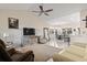 Open concept living room into dining area with vaulted ceilings, neutral paint and ceiling fan at 799 Mount Gilead Place Dr., Murrells Inlet, SC 29576