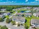 Beautiful aerial view of the condo complex with ponds, a pool, and mature trees at 828 Sail Ln. # 203, Murrells Inlet, SC 29576