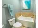 Cozy bathroom with soaking tub, neutral tile surround, and modern fixtures at 828 Sail Ln. # 203, Murrells Inlet, SC 29576