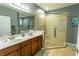 Spacious bathroom featuring double vanity, walk-in shower with seat, and updated fixtures at 828 Sail Ln. # 203, Murrells Inlet, SC 29576