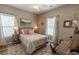 Cozy bedroom with coastal decor, natural light, and comfortable furnishings at 828 Sail Ln. # 203, Murrells Inlet, SC 29576