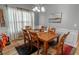 Dining room with a wooden table, six chairs, and neutral wall colors at 828 Sail Ln. # 203, Murrells Inlet, SC 29576