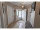 Inviting foyer with tile flooring and a bench, leading to the main living area at 828 Sail Ln. # 203, Murrells Inlet, SC 29576