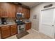 Cozy kitchen with granite countertops, stainless steel appliances, and wooden cabinets at 828 Sail Ln. # 203, Murrells Inlet, SC 29576