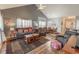 Spacious living room with vaulted ceilings, a ceiling fan, and an open dining area at 828 Sail Ln. # 203, Murrells Inlet, SC 29576