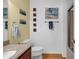 Bright bathroom with a stylish vanity, sink, toilet, shower and wooden floors at 9514 Leeds Circle, Myrtle Beach, SC 29588