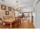 Inviting dining area with a chandelier and view into the living room, enhancing the home's appeal at 9514 Leeds Circle, Myrtle Beach, SC 29588