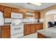 Spacious kitchen with wood cabinets, tile backsplash, and modern appliances, perfect for cooking at 9514 Leeds Circle, Myrtle Beach, SC 29588
