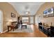 A living room boasting hardwood floors, neutral colored walls, a ceiling fan, and front door access at 9514 Leeds Circle, Myrtle Beach, SC 29588