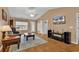 Cozy living room featuring hardwood floors, high ceiling, and a comfortable sitting area at 9514 Leeds Circle, Myrtle Beach, SC 29588