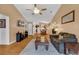 Inviting living room with hardwood floors, a ceiling fan, and an open floor plan at 9514 Leeds Circle, Myrtle Beach, SC 29588