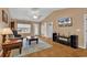 This is a living room featuring hardwood floors, a ceiling fan, and access to the front entryway at 9514 Leeds Circle, Myrtle Beach, SC 29588